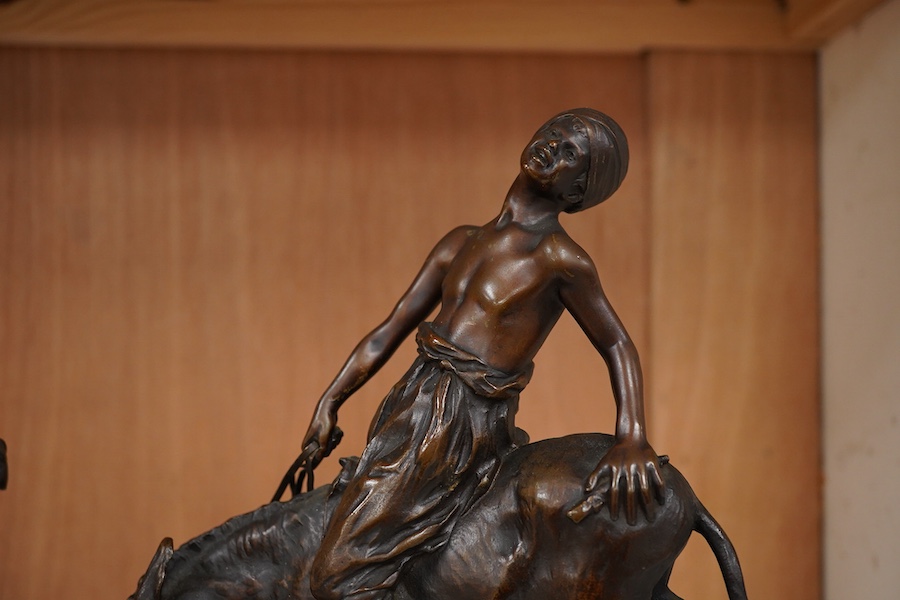 After Paul Aichele (1859-1910), a pair of bronze figures of Arab boys riding donkeys, 23cm